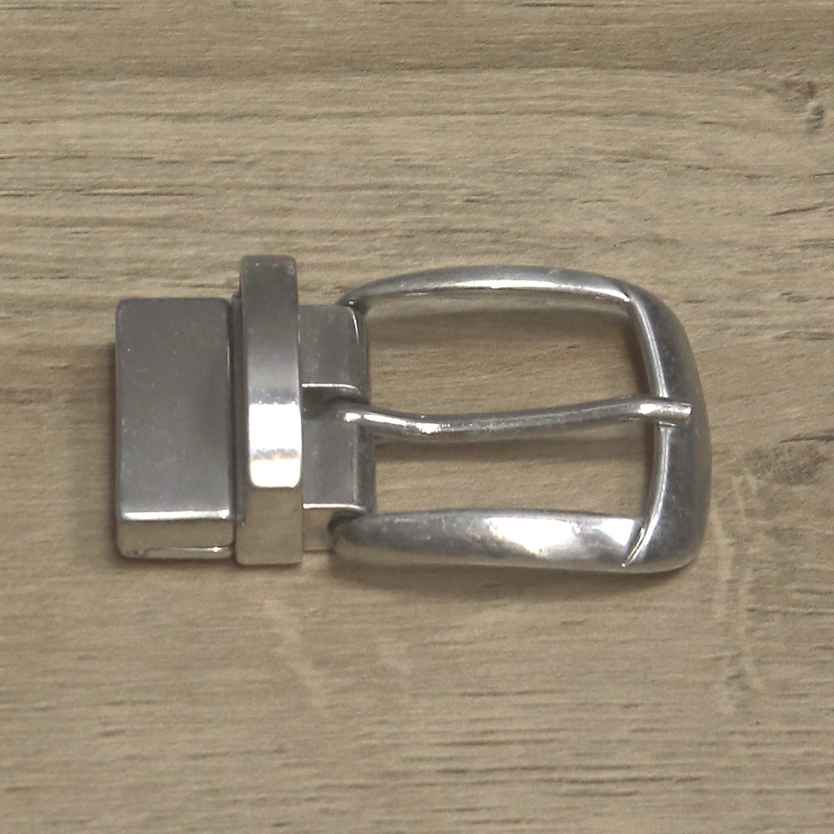 Nickel clamp buckle side on, showing the depth of the clamp