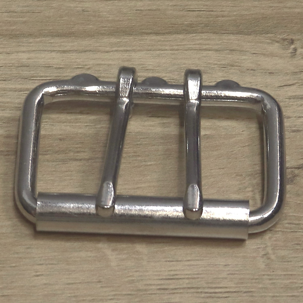 Double prong roller buckle from above with the roller at the bottom